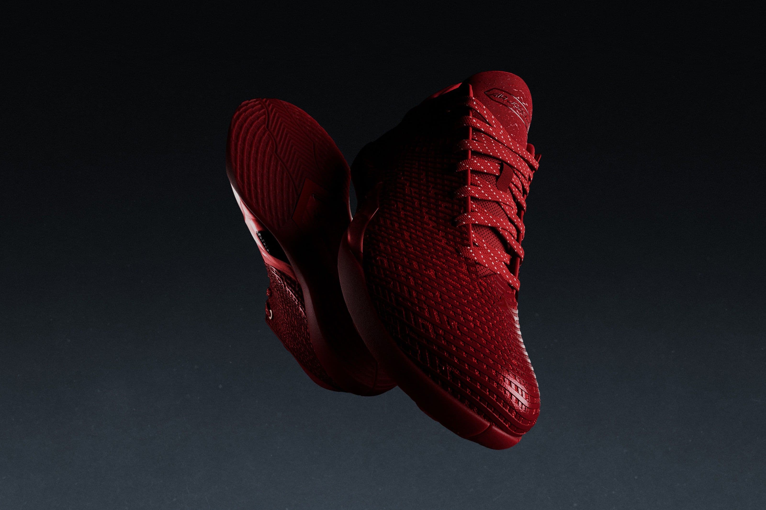 Air Jordan 41 colorway Ruby su sfondo scuro, dettaglio dell'upper in nano print mesh e suola ZoomX